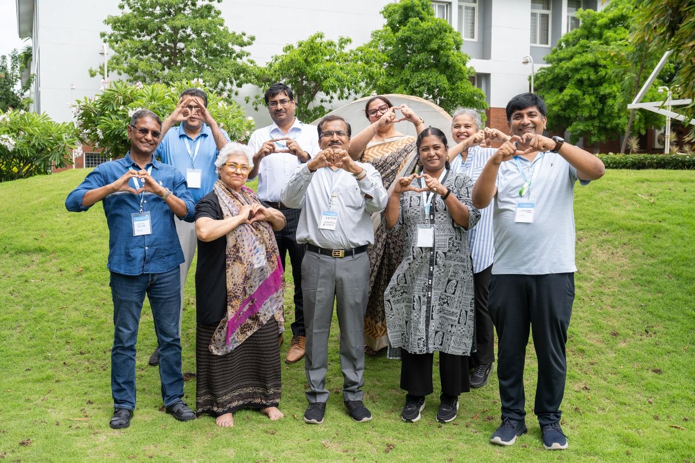 Group of leaders making heart signs with their hands