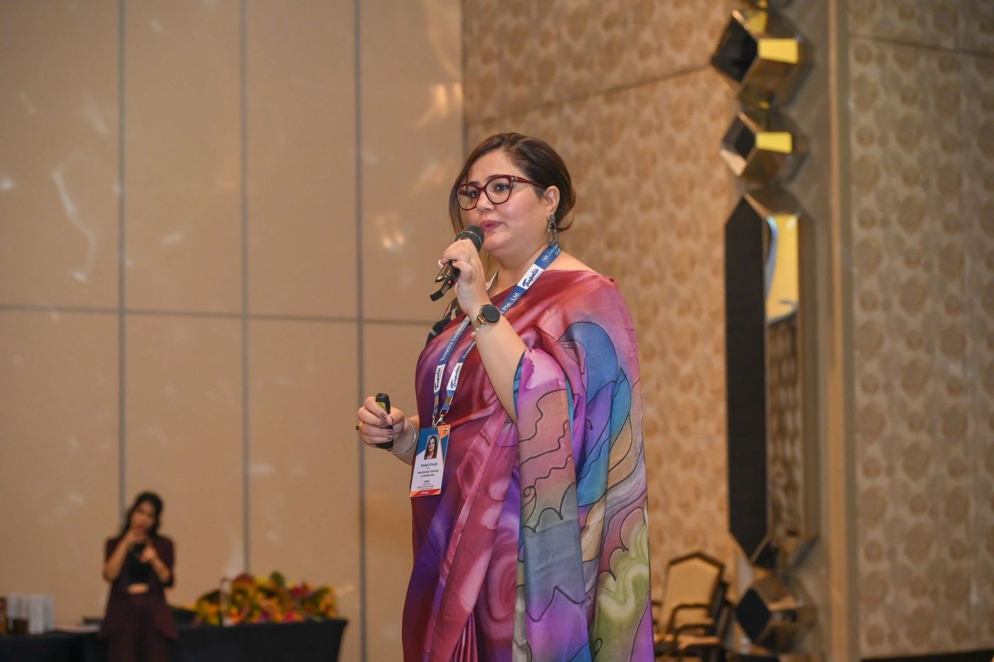 Deep delivering a keynote with a microphone